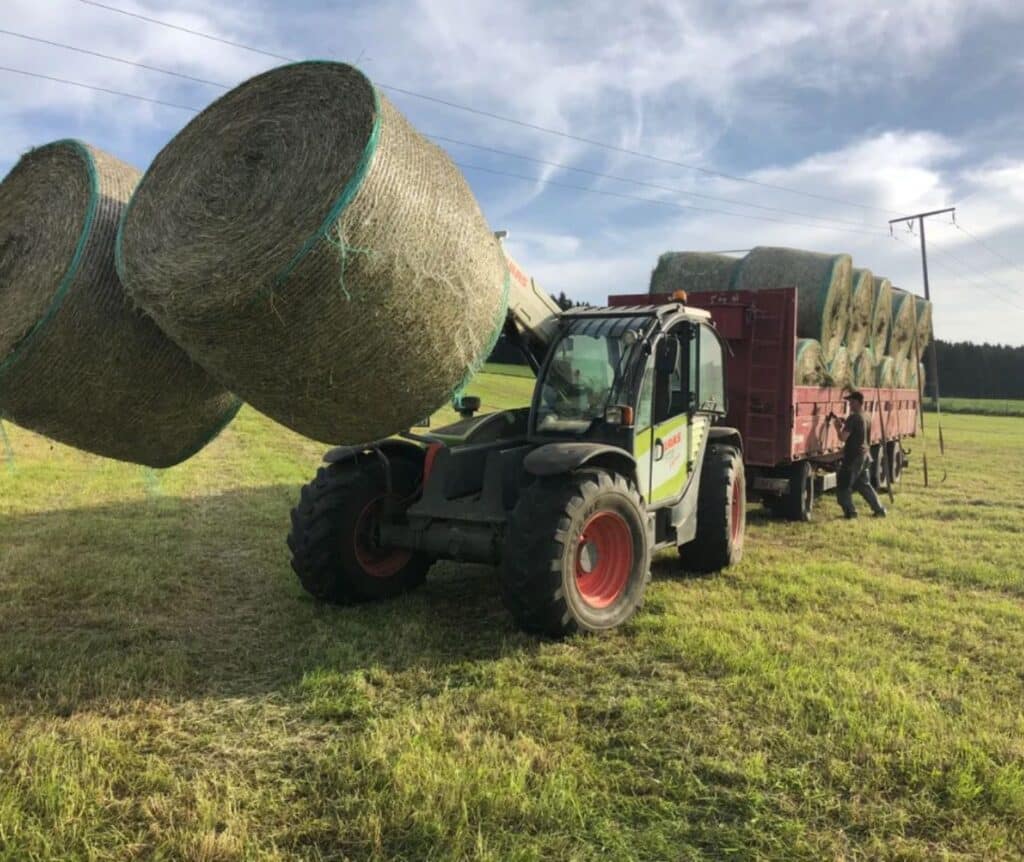 Tracktor with haystack on farm